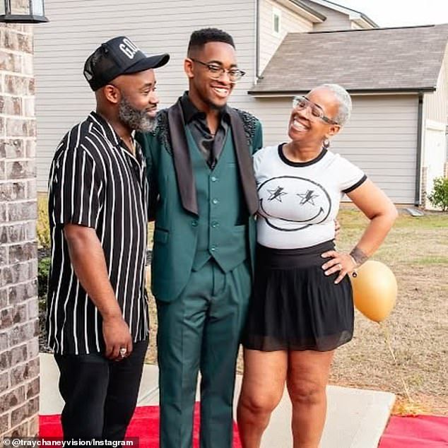 The Wire actor Tray Chaney (L) shared an update on his son Malachi's condition after the 19-year-old (center) was carried away by a tornado that swept through their home on May 29; pictured with Chaney's wifeAyesha
