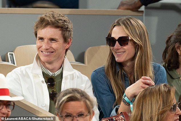 The Oscar winner cut a stylish figure in a green sweater and jeans which he layered with an alabaster Lacoste sports jacket.