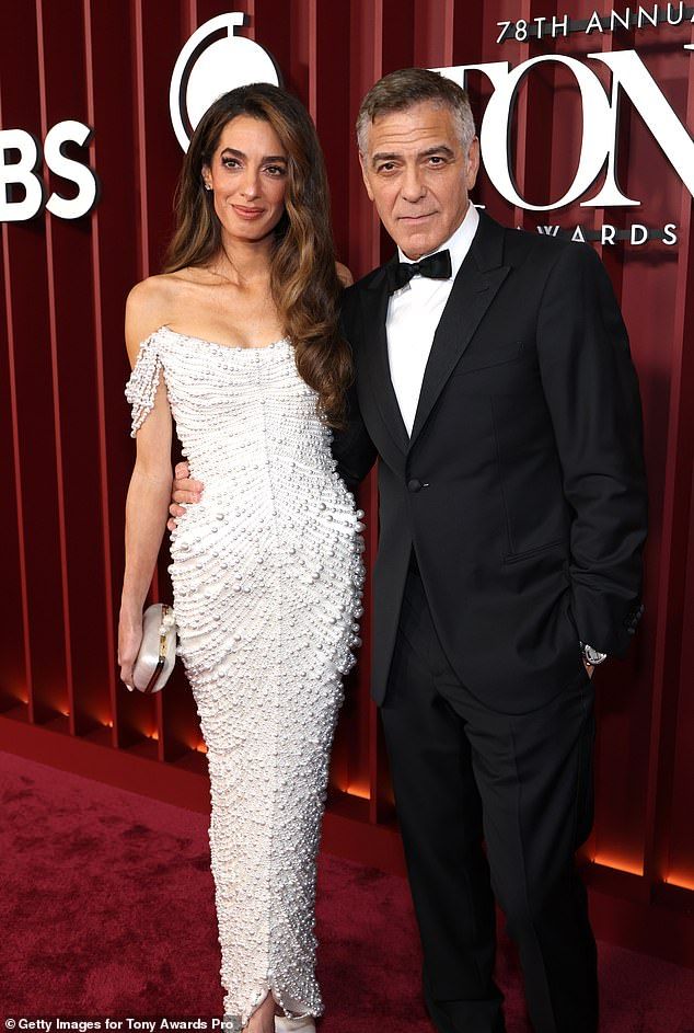 She accessorized the look with a marble clutch