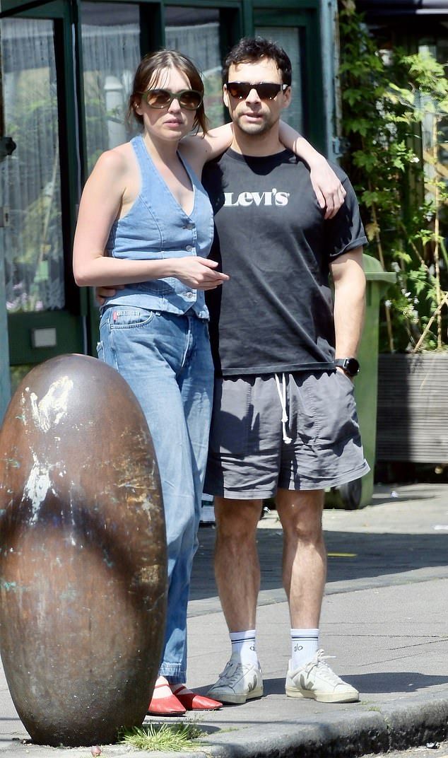 While the pair have not commented on their relationship status, they looked incredibly close as they cosied up to one another on their day out