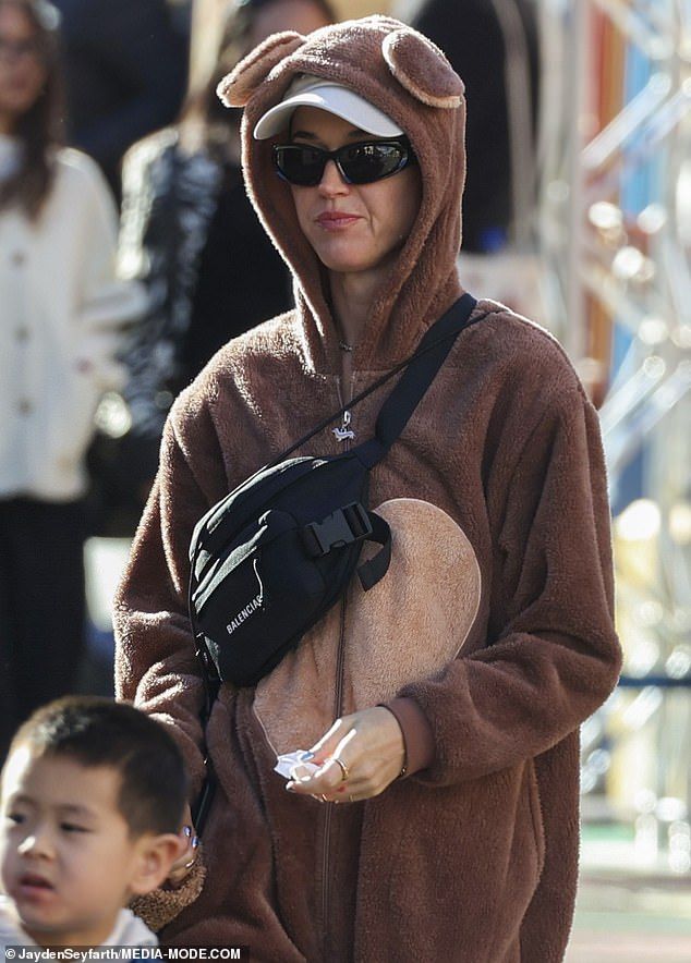 Daisy complemented her mother's costume with a mini version of the same bear costume
