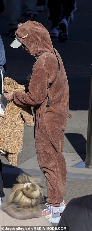 However, the little girl also wore a fuzzy brown coat on the chilly day