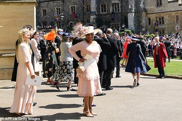 Oprah leaving the wedding ceremony.According to author Tina Brown, the star had 'scarcely met' Meghan before the big day