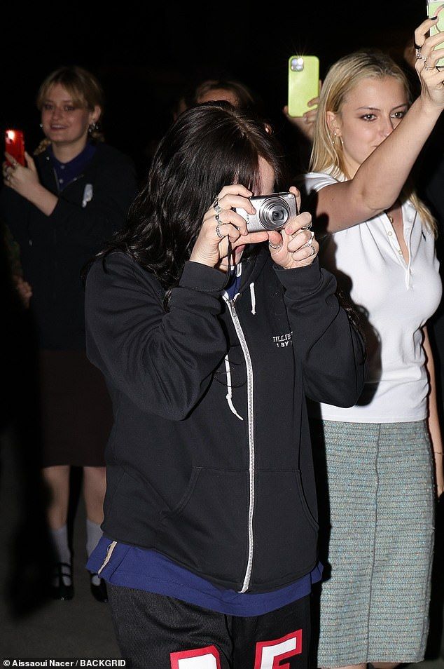 She and her friends all had cameras or phones out to snap photos to capture the City of Lights in all its glory. Just days earlier she was spotted in Italy, where she erased questions about her romance with Nat