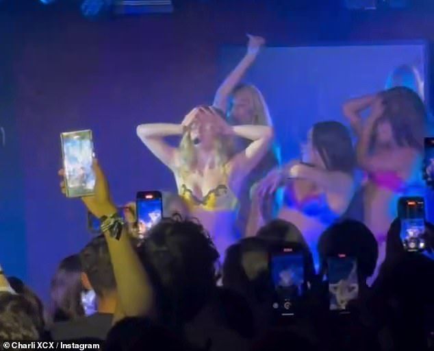 Addison could be seen performing a very sultry routine, surrounded by a group of female backing dancers, while cladin a skimpy yellow silk bra and underwear set