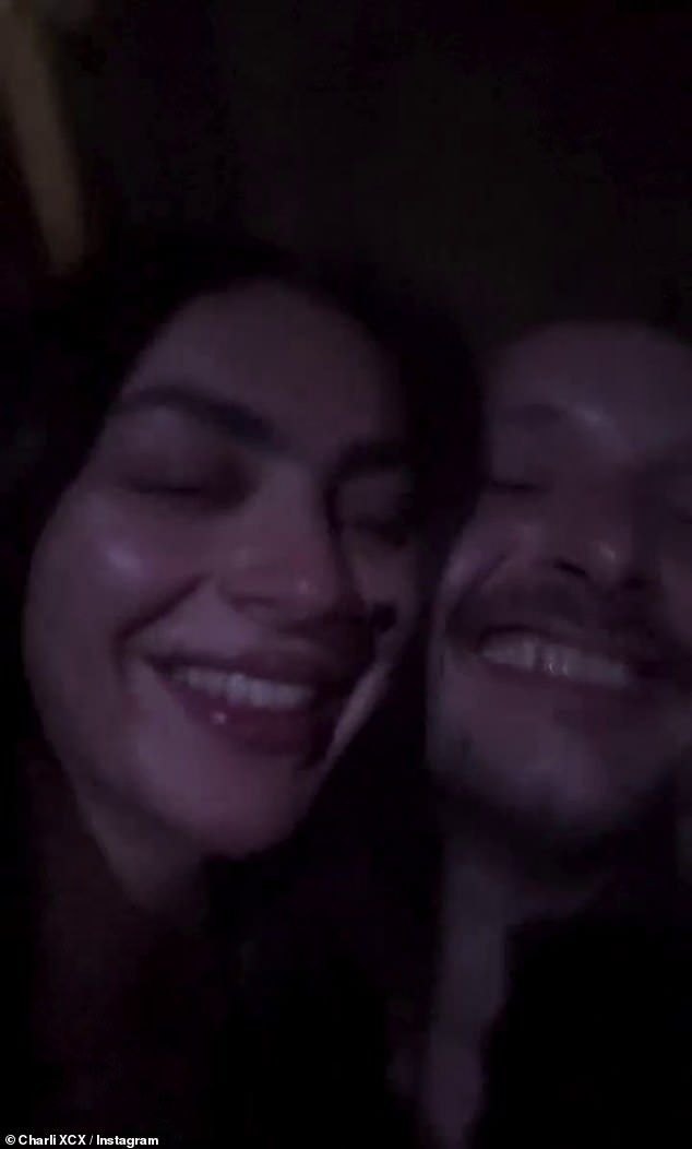 And among them was Charli, who filmed herself cosying up to fianc George and sipping on a glass of white wine as she danced and sang along