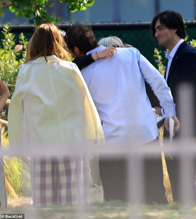 The former married couple proved that all is fine between the both of them as they shared a hug at the celebration