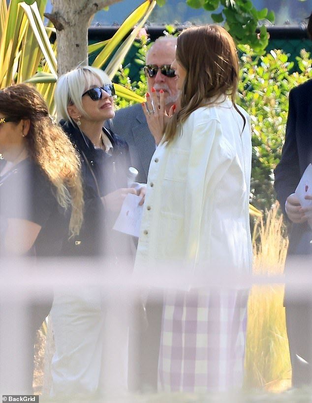 All was good between the action man's ex wife and current wife as they also shared an embrace