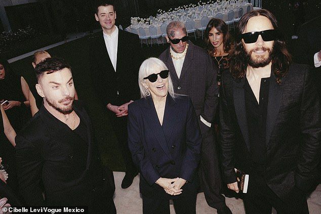 The Louisiana-born brothers beamed while being supported at the family function by their mother, Constance (M)