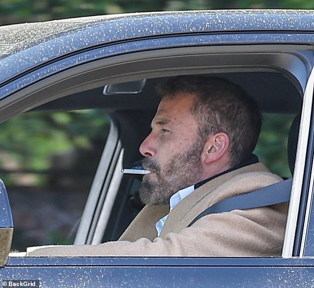 Ben Affleck, 52, looked stressed when he was spotted smoking a cigarette while driving home from his office in LA on Wednesday