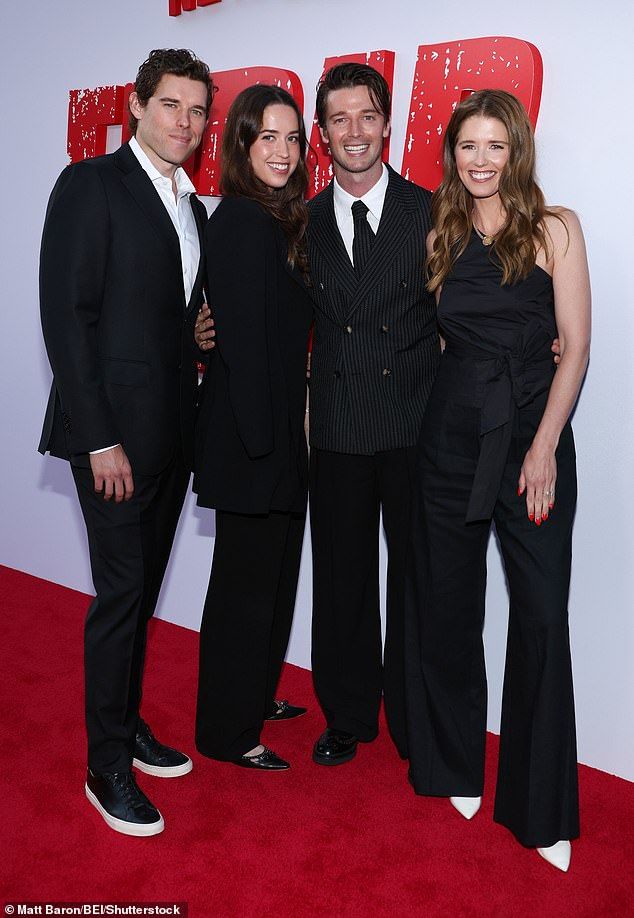 Katherine rounded out the quartet of siblings in a single-shoulder black blouse with a large bow tied around her midriff and matching slacks with contrasting pointy white heels