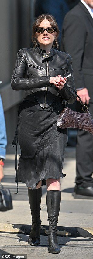 Aimee teamed her jacket with a black midi skirt and knee-high black boots