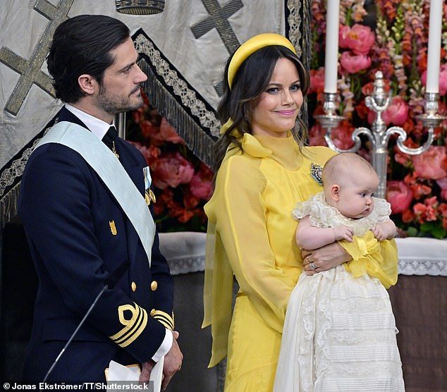 Prince Carl Philip and Princess Sofia with Princess Ines during thechristening in Drottningholm Palace Chapel