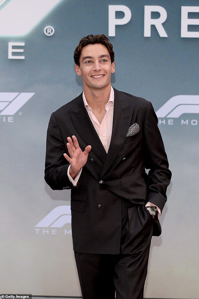 He flashed a smile and waved at onlookers