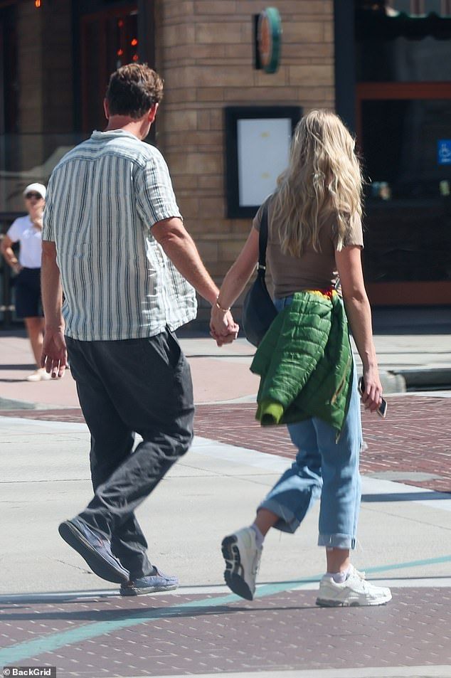 Kayla proudly flaunted her stunning diamond engagement ring during their outing while rocking a casual look of a brown shirt with jeans