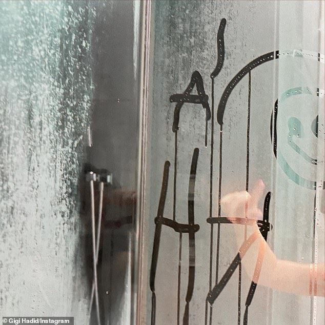 Khai - whose name translates to 'crown' in Arabic - showed off how well she could spell her own initials on the condensed shower door in another candid photo