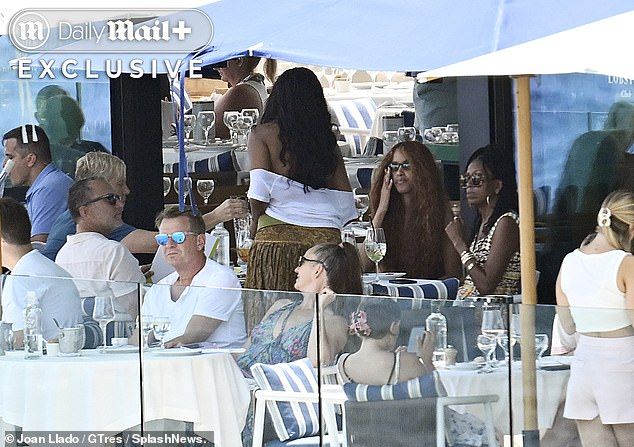 Michelle Obama and her daughters were pictured enjoying lunch at an exclusive club on the idyllic Spanish island of Mallorca.