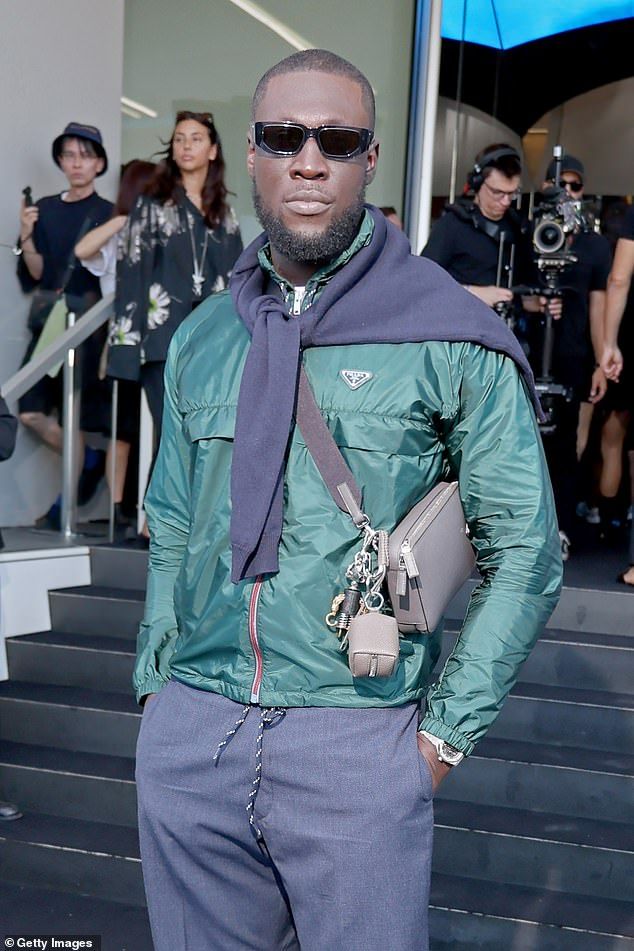 Rapper Stormzy, 31, arrived for the show in a dark green Prada shell jacket with a pair of dark grey pleated trousers