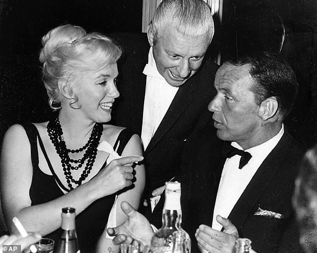 Sinatra had numerous affairs including with Marilyn Monroe. They were pictured together talking to an unidentified man in a club outside Lake Tahoe