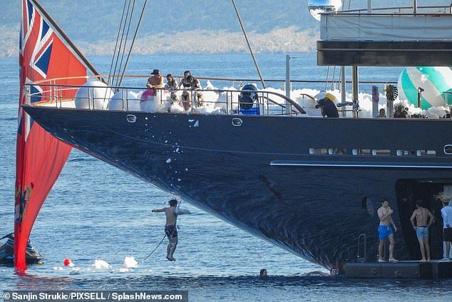 The rowdy party saw young guests diving off the back of the yacht into the water below