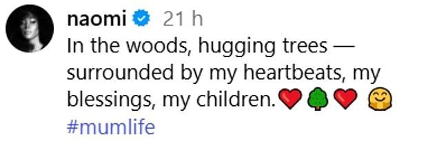 'In the woods, hugging trees  surrounded by my heartbeats, my blessings, my children. ,' she wrote