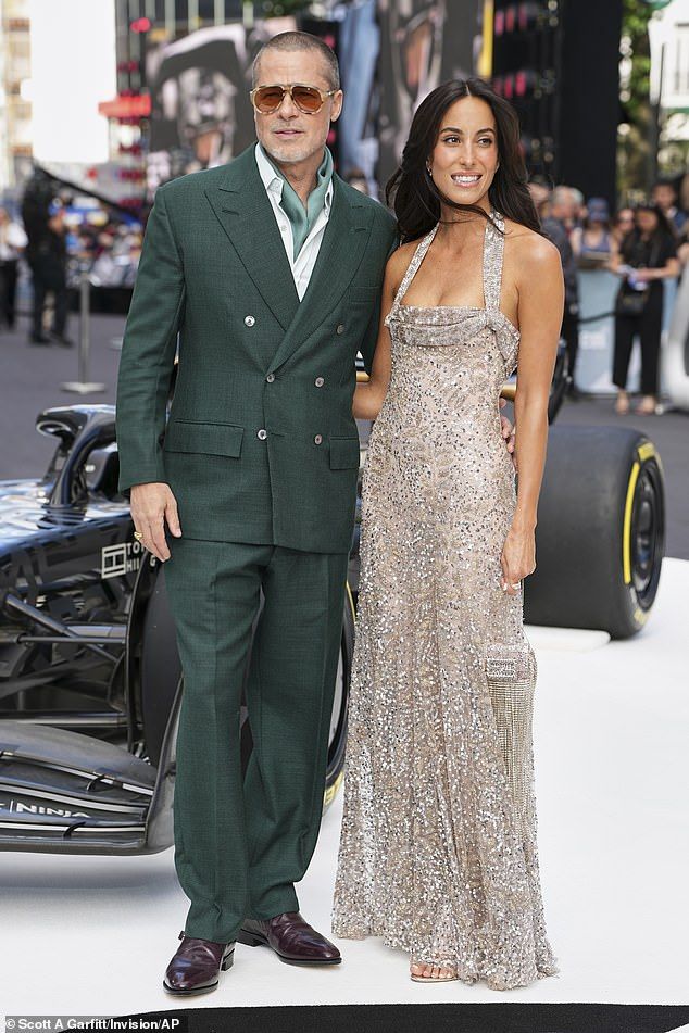 Brad Pitt looked positively smitten as he packed on the PDA with his girlfriend Ines de Ramon for the European premiere of F1: The Movie in London on Monday night