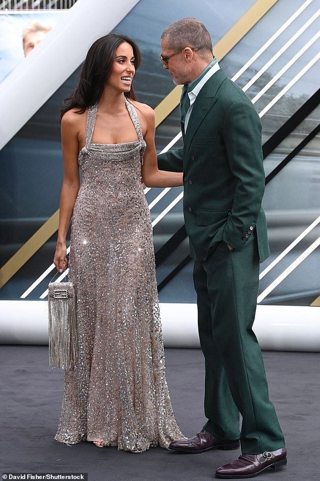 She ensured all eyes were on her in the show-stopping number, which was encrusted in intricate beading and sequins and flashed a glimpse of her ample cleavage