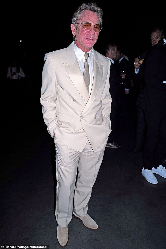 The actor, who has only featured in two movies since he finished as 007, donned a typically suave cream tux and co-ord tie for the occasion.