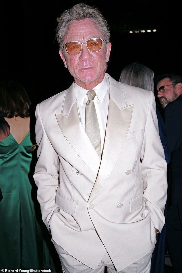 Daniel Craig, 57, looked worlds away from his James Bond days as he arrived at the star-studded Tate Modern 25th Anniversary Gala in London on Wednesday night sporting fuller hair and quirky attire