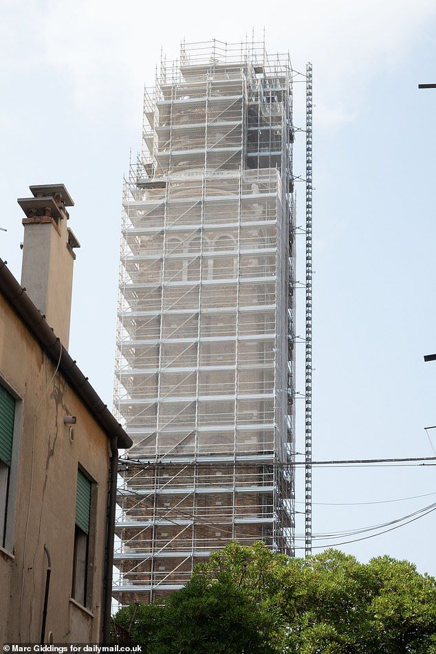 The bell tower of the 15th Century Madonna dell Orto church in Venice's quaint Cannargio district is currently covered in scaffolding