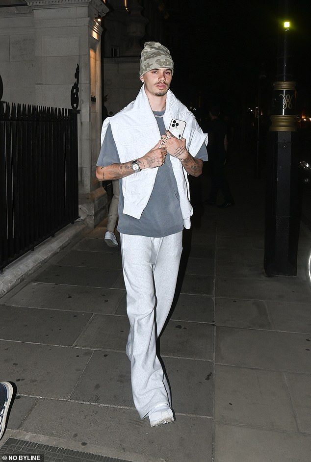 Romeo Beckham, 22,showed off yet another tattoo on Thursday evening as he was pictured leaving the plush Twenty Two hotel in London
