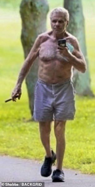 The 78-year-old actor and martial artist created a bizarre image as he puffed on a cigar while taking a stroll in Franklin, Tennessee, near Nashville