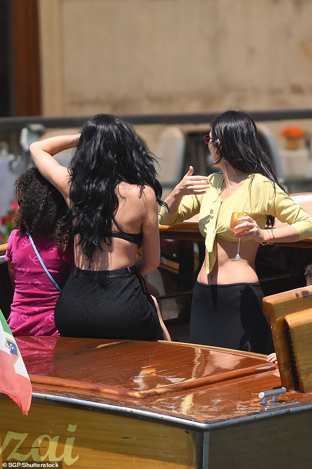 The trio all appeared in good spirits on the boat