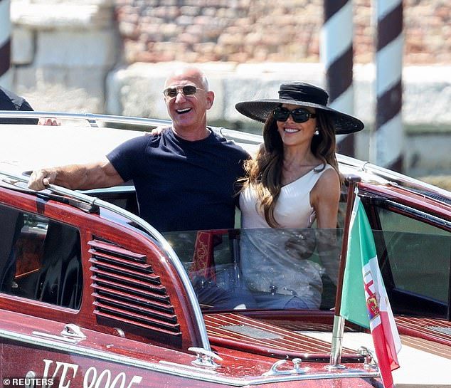 The loved-up couple were seen waving at photographers as their boat pulled away from Aman Venice Hotel in the romantic Italian city