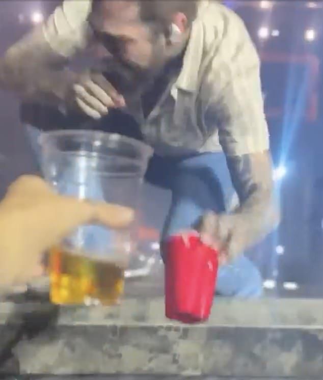 In the viral clip, Post is performing his and Blake Shelton s duet Pour Me A Drink with a red solo cup in hand
