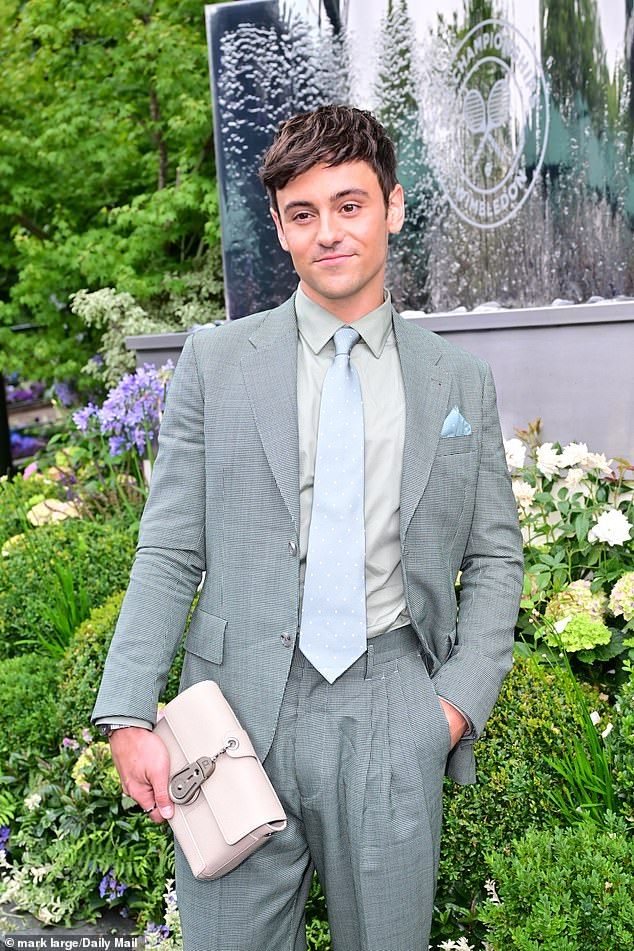 He added a designer touch with aChristian Louboutin clutch bag