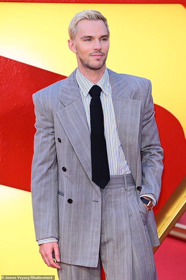 He wore a dapper grey suit and tie