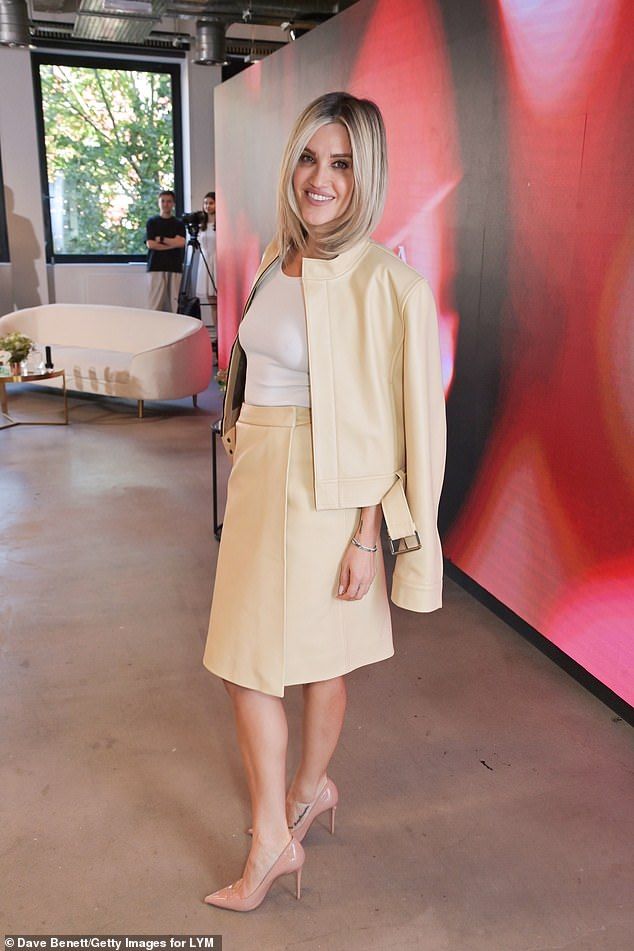 Ashley finished off the stunning outfit with a white top, nude stiletto heels and accessorised with a yellow fur mini bag