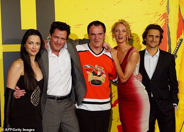 The star - known for his frequent Quentin Tarantino collaborations - is pictured with Kill Bill co-stars Uma Thurman andJulie Dreyfus along with Tarantino and producer Lawrence Bender in 2003