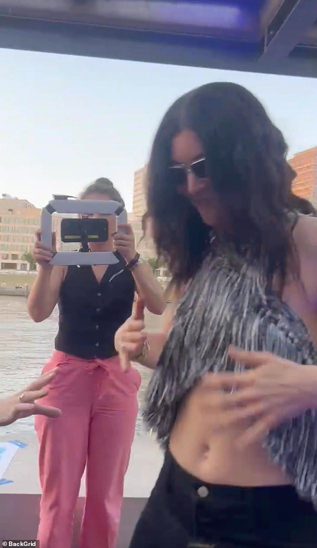 Lorde accessorised her outfit with a pair of rectangular sunglasses and styled her hair into waves