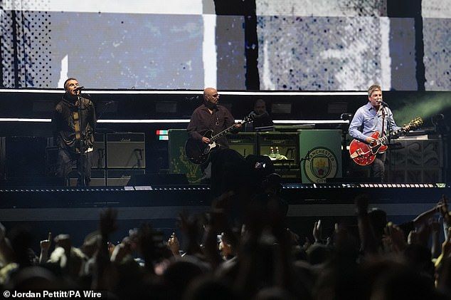 Liam and Noel Gallagher have finally arrived on stage at Cardiff's Principality Stadium for first night of the long-awaited Oasis reunion tour