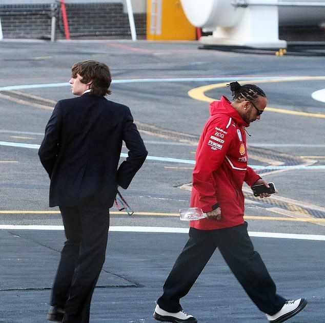 The actress, 29, and her husband Malcolm McRae, were spotted climbing out of chopper, after showing their support for Lewis, 40, at Silverstone
