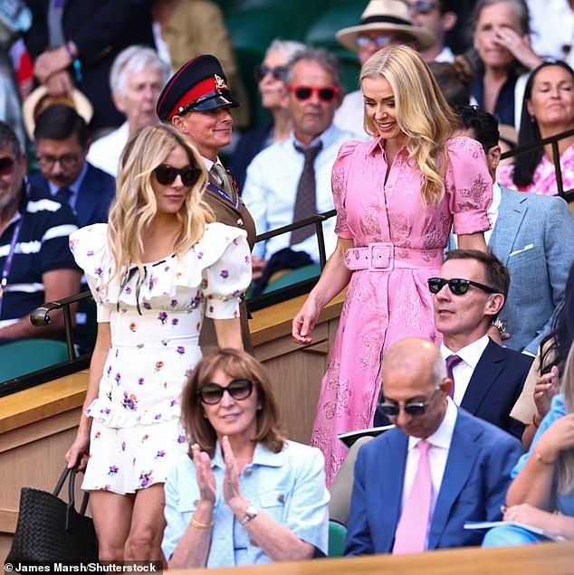 Miller and Jenkins searched for their seats in the Royal Box after arriving on Centre Court