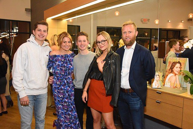 The pair have been married since 1996 and are parents to three adult children: Natasha, 26, Lev, 25, and Maksim, 23; pictured March 2017 in Los Angeles, from left to right: Lev Bure, Candace Cameron Bure, Maksim Bure, Natasha Bure and Valeri Bure
