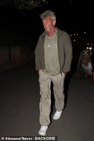 Sean Penn looked solemn as he arrived at dinner separately to his girlfriend Valeria Nicov before partying with friends in Paris on Tuesday