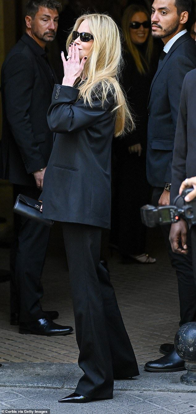 Nicole looked effortlessly chic in an oversized black suit jacket with tailored trousers, as well as sunglasses and patent stilettos