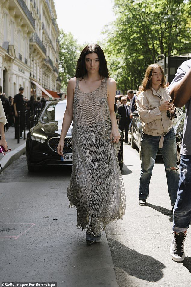 The singer, 28, who is in the French capital for haute couture fashion week, left little to the imagination as she taped her breasts and wore the see-through number