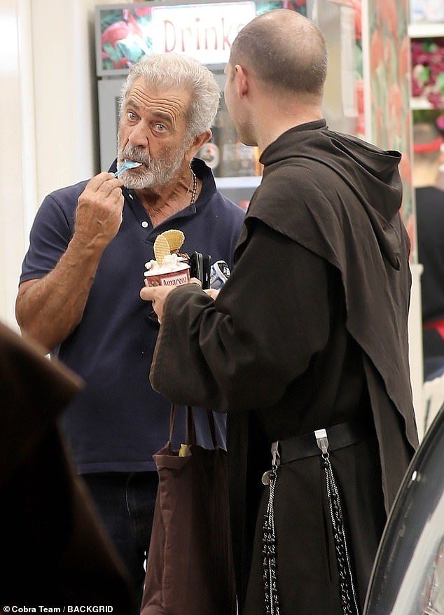 The trio were seen holding a conversation as they quickly stopped inside a gelateria and left after purchasing small cups of the sugary dessert