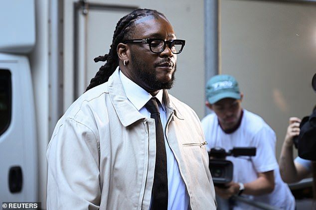 Omololu Omari Akinlolu, a co-defendant with U.S. singer Chris Brown (not pictured) arrives at court on Friday morning