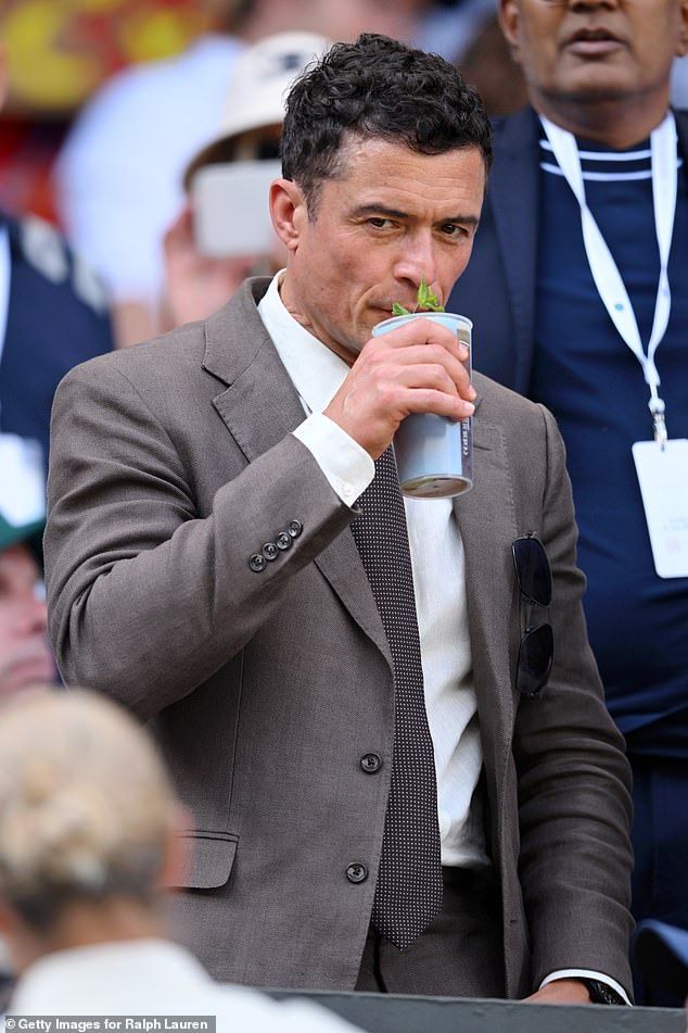 Orlando Bloom sipped on a glass of Pimms from the stands